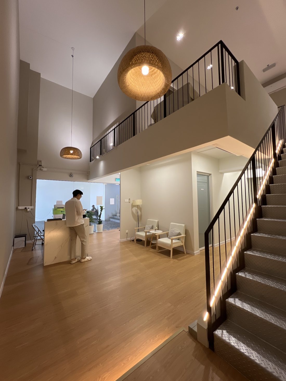 Smilee Dental lobby with rattan pendant lamp and oak floors