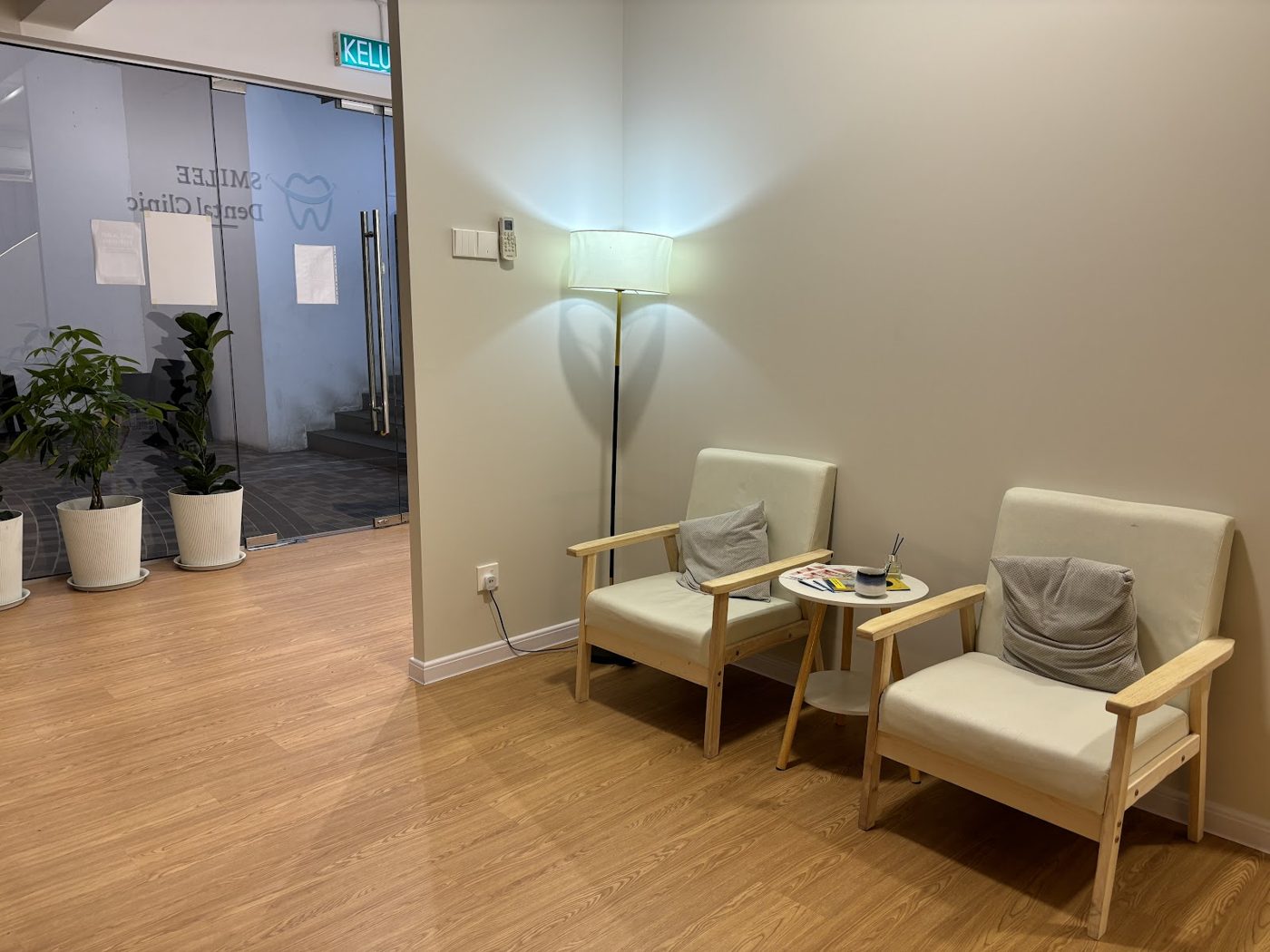 Waiting area with cream armchairs